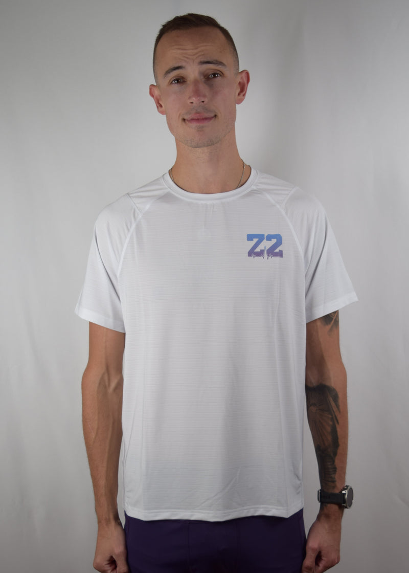 Core performance running top in white, with a purple Z2 logo on the front.