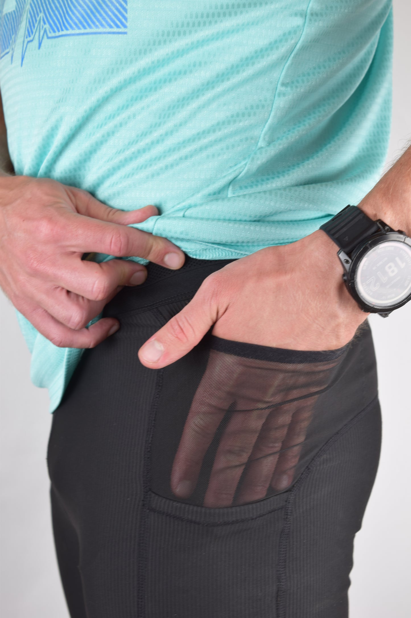 The enduro tights in black with the model showing the depth of the pockets