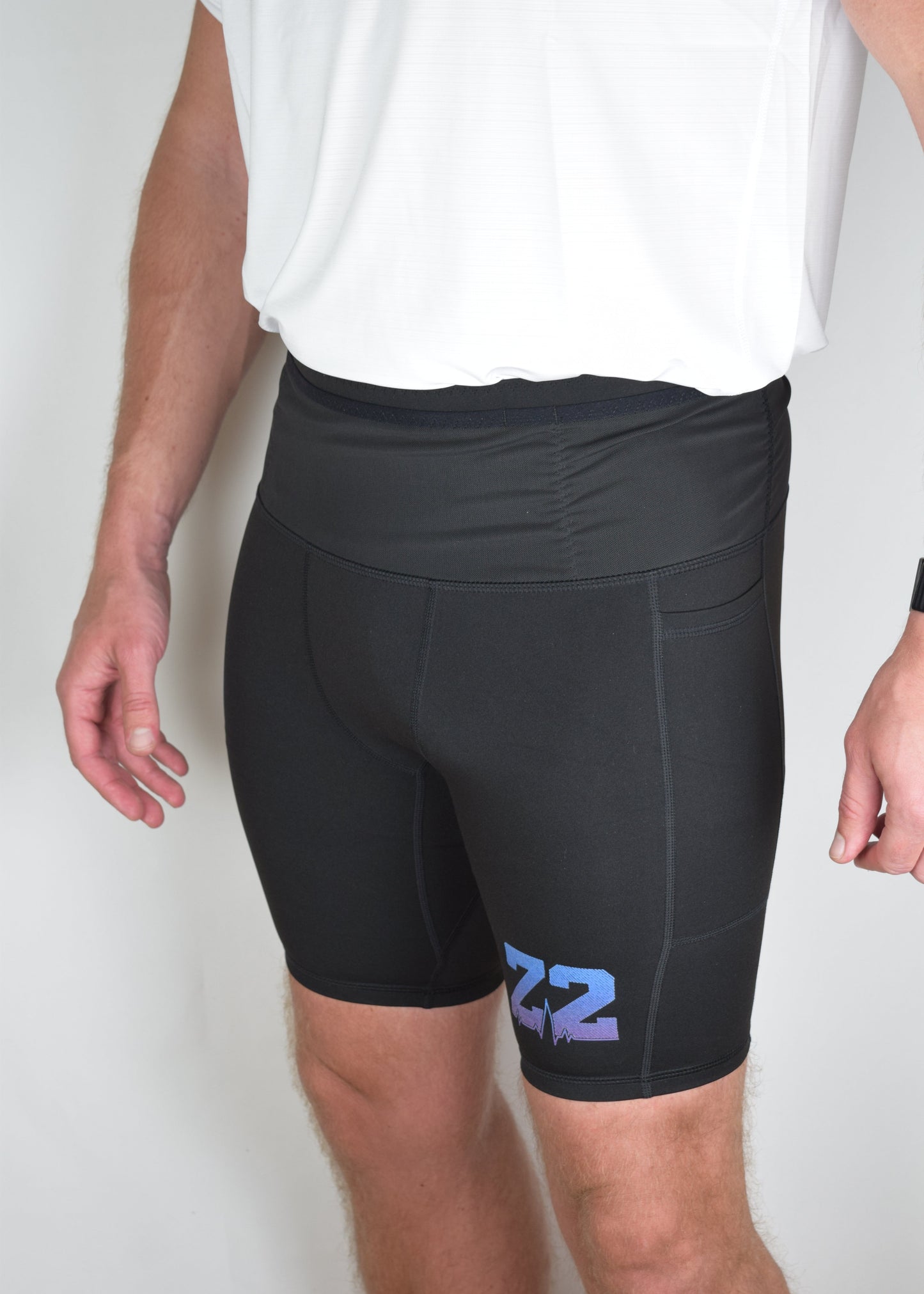 Orbit half tights in Black without anything in the built in running belt orgenerous pockets.