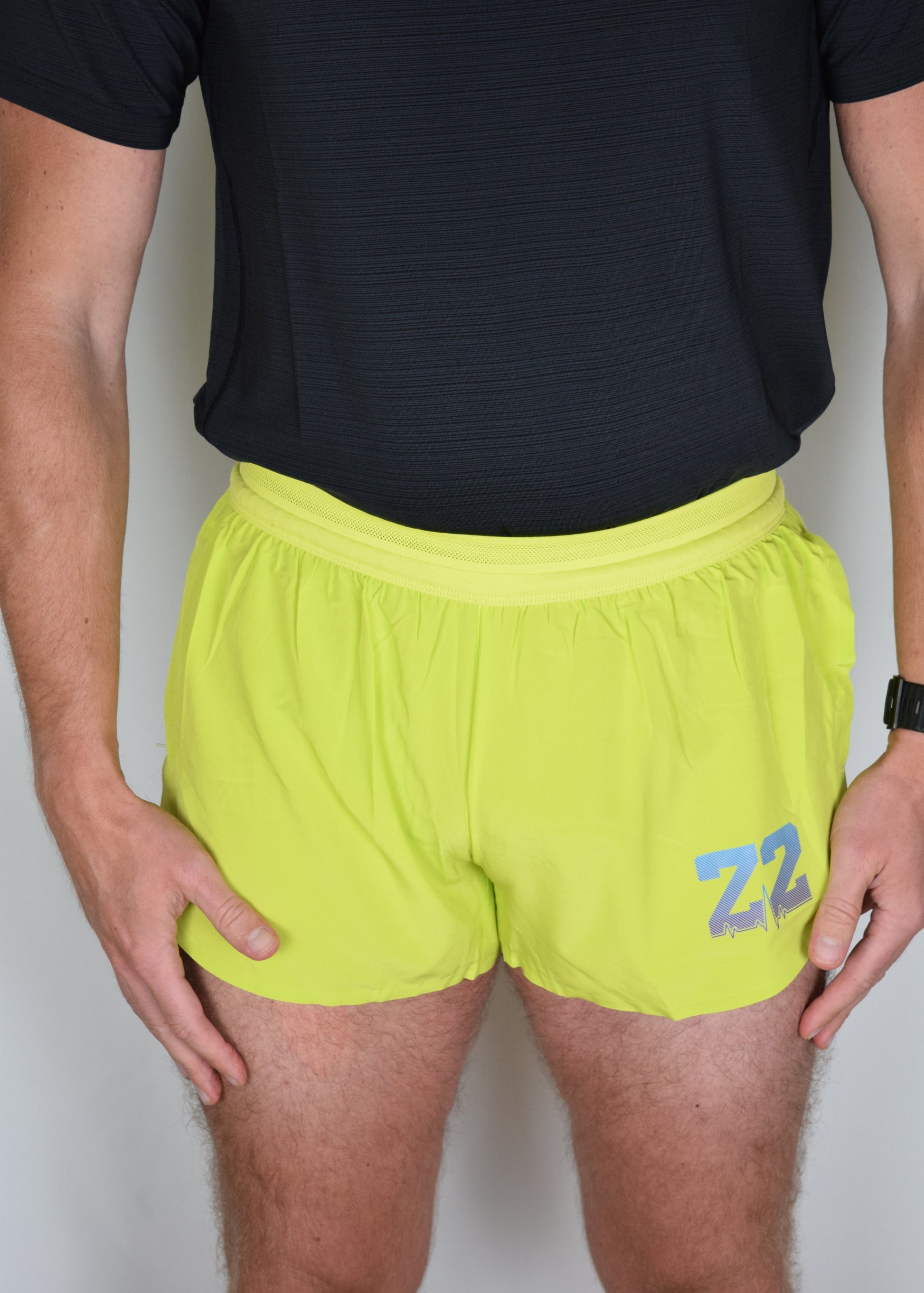 Stride 4 inch running performance shorts in yellow, facing forward