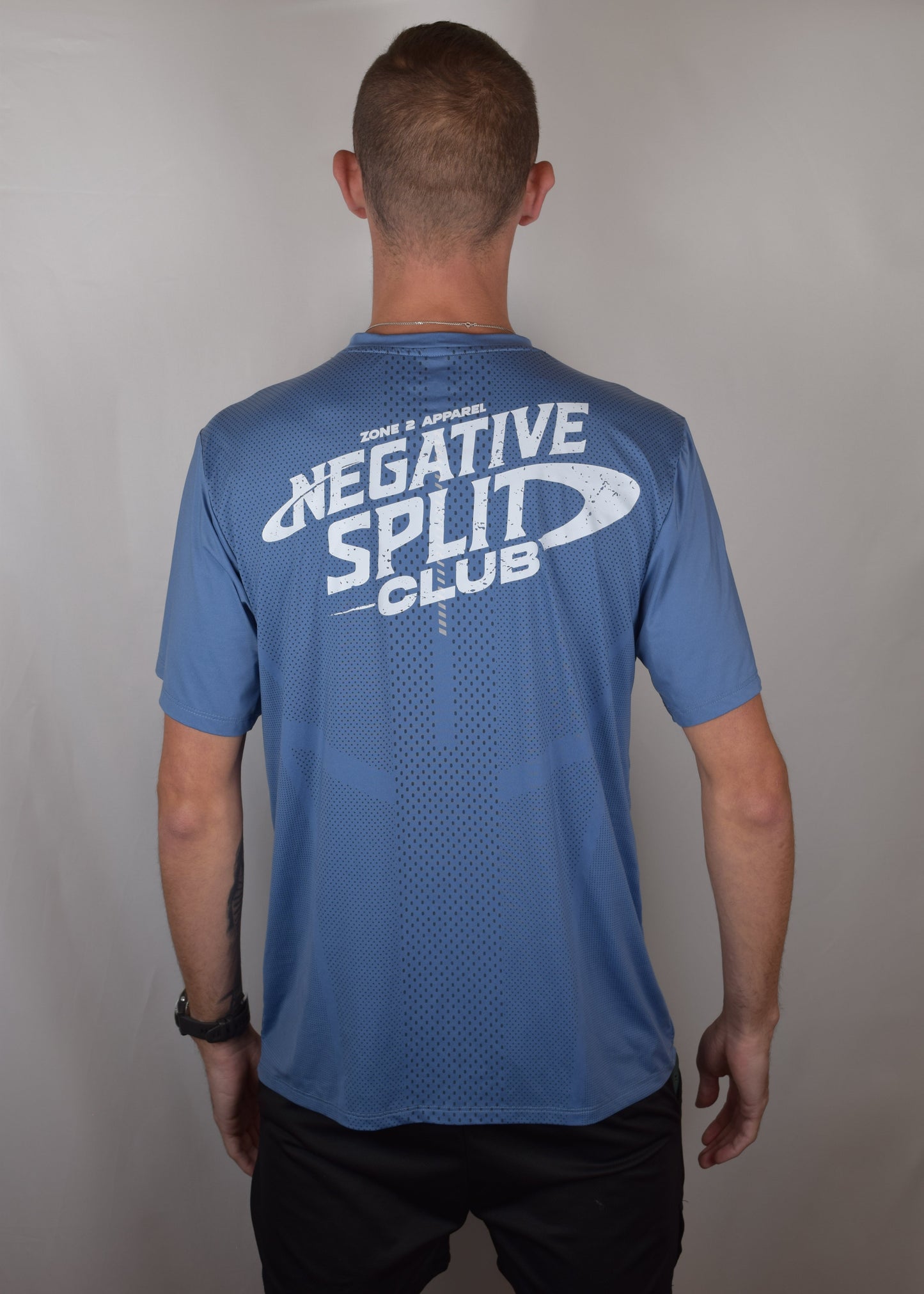 The Split Tee Technical Running T-Shirt in blue from the back with Negative Split Club printed