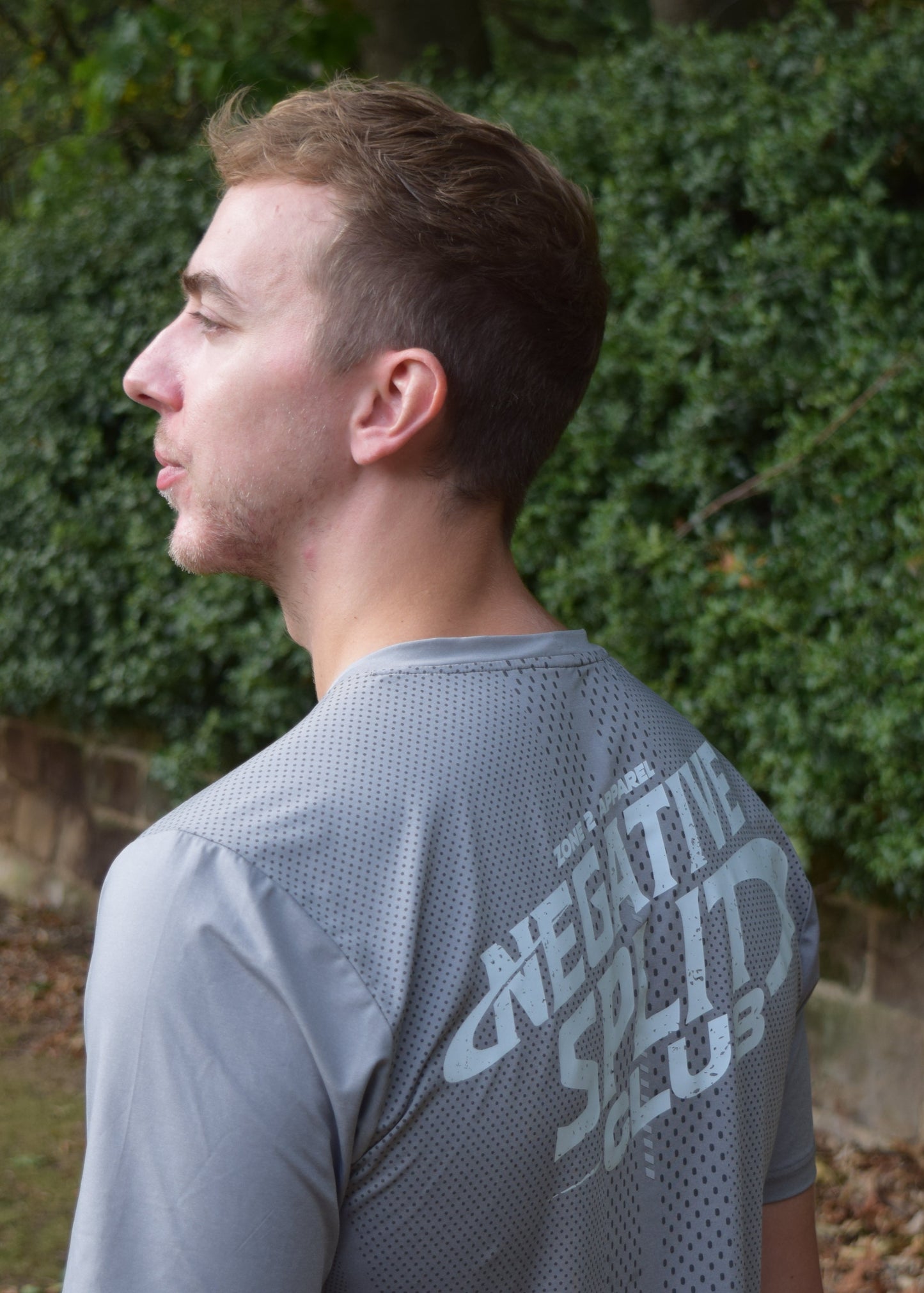 The Split Tee Technical Running T-Shirt in grey from a 45 degree angle