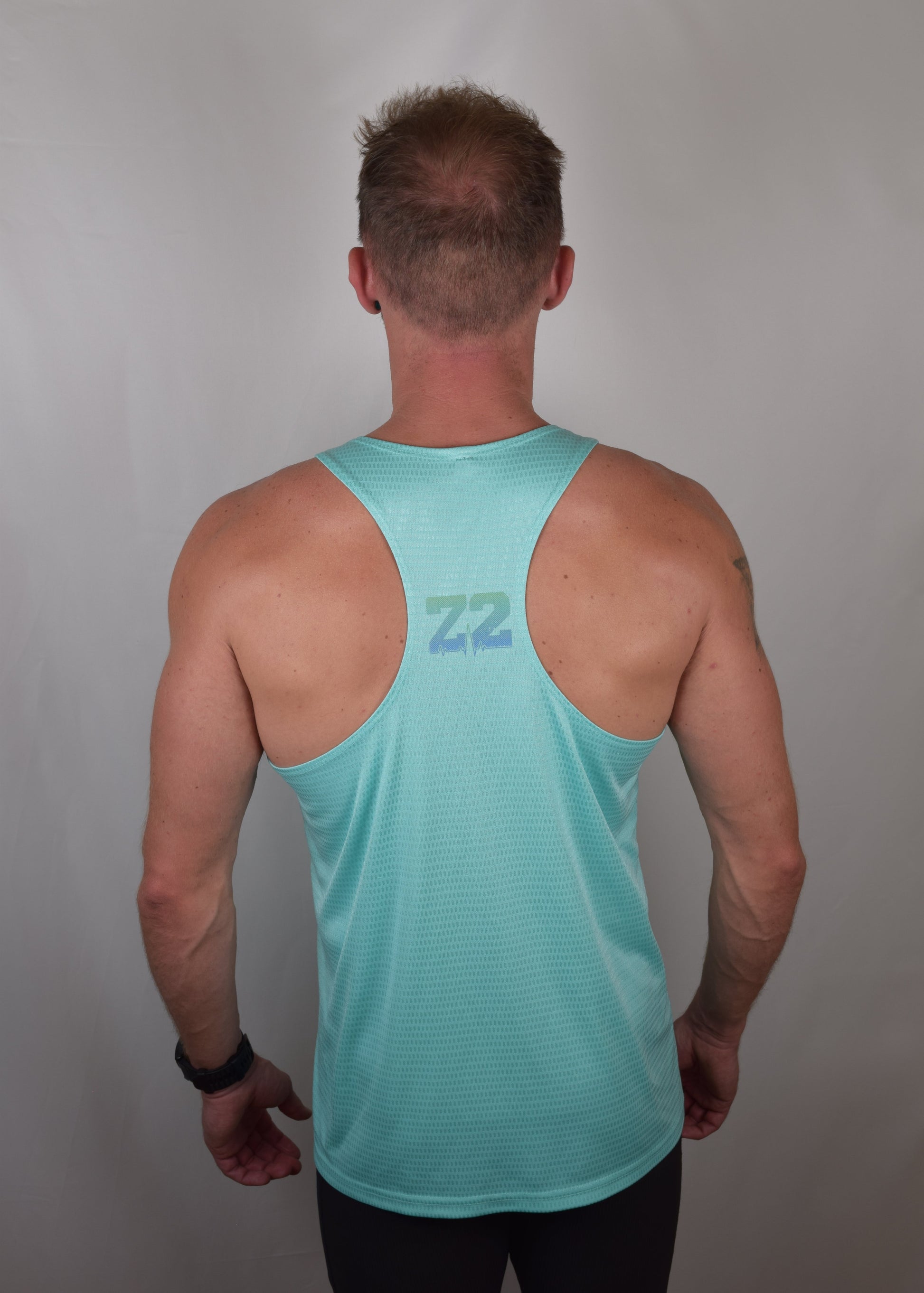 The Win Running Vest in Turquoise from the back