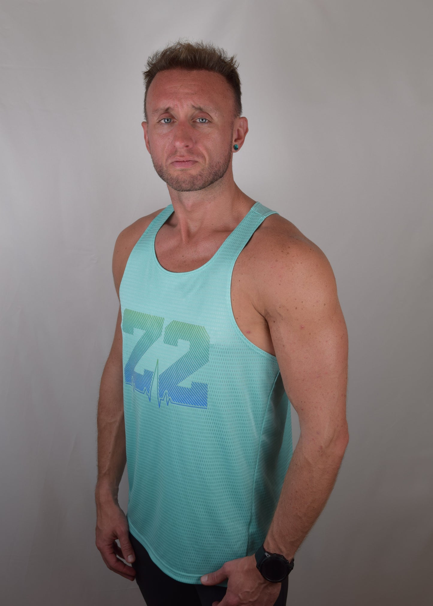 The win technical running vest in turquoise from a 45 degree angle