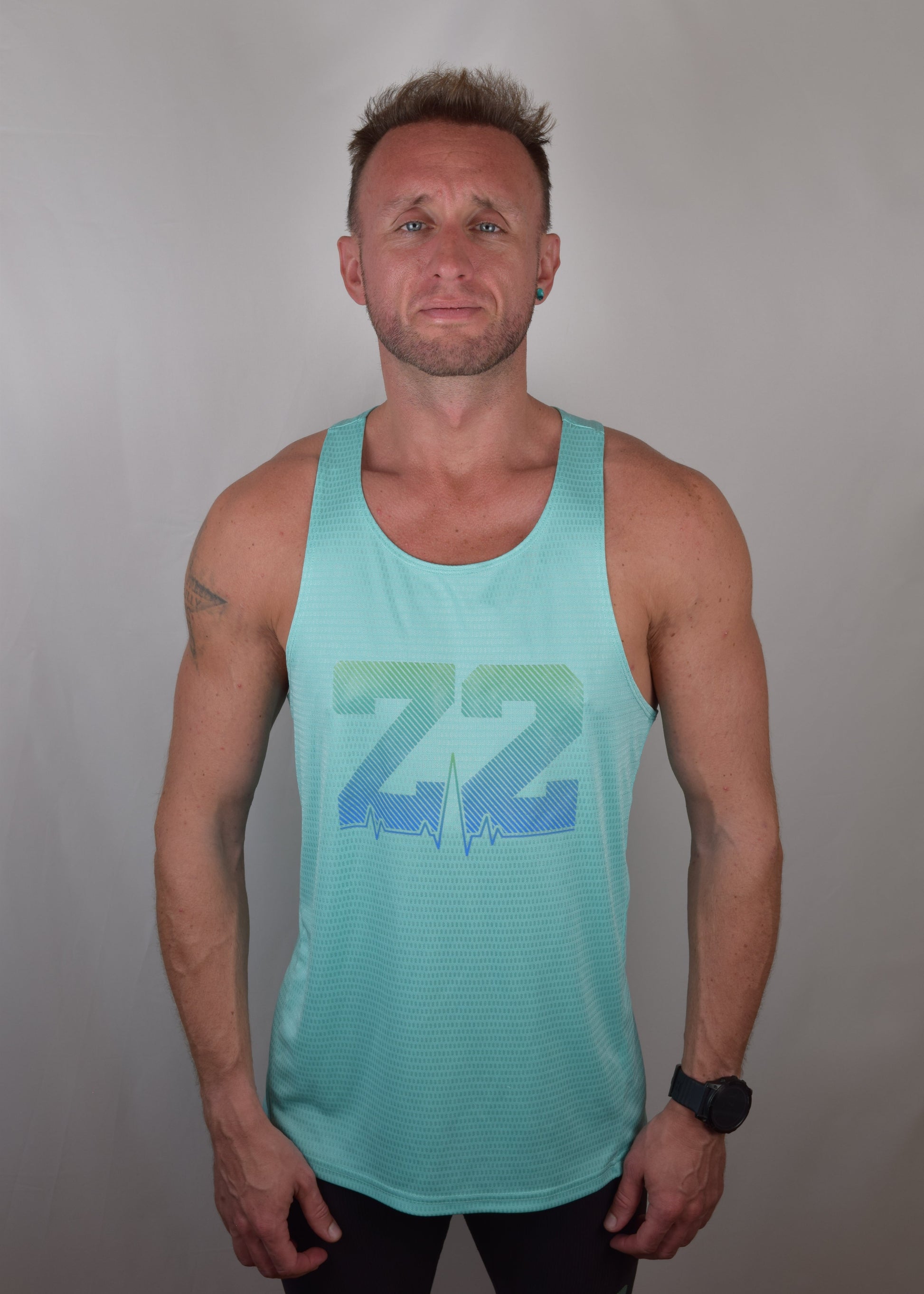 The win technical running vest in turquoise from the front